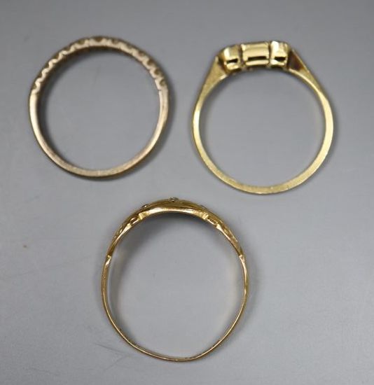 Three assorted 18ct and gem set rings including diamond half eternity and three stone diamond, gross 6.1 grams.